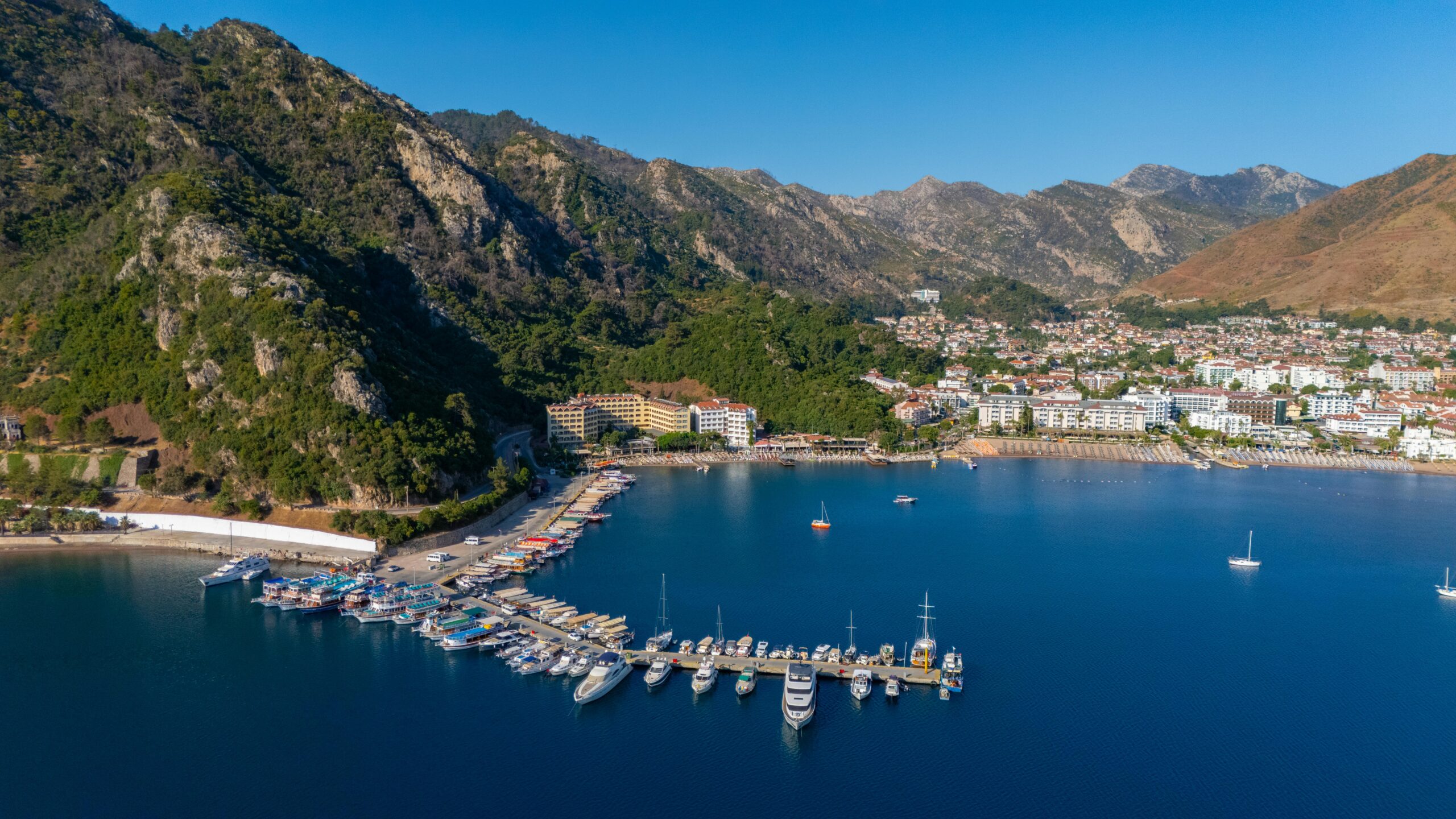 Stunning aerial view of Marmaris marina nestled between mountains and the sea.