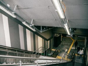 Concrete interior stairs with handrails in an İstanbul subway station.